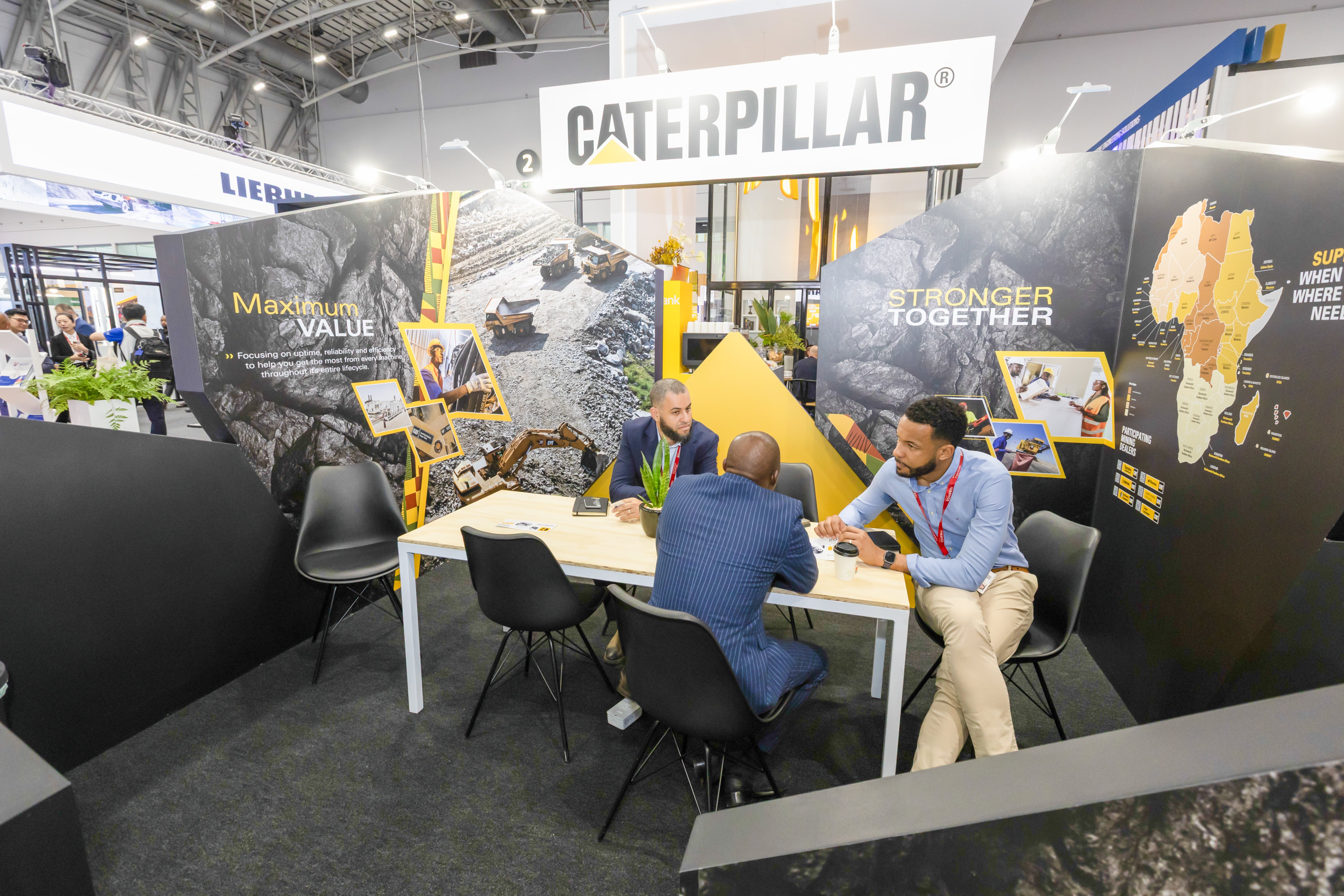 Customer consluting by the CAT stall at the Mining Indaba Event